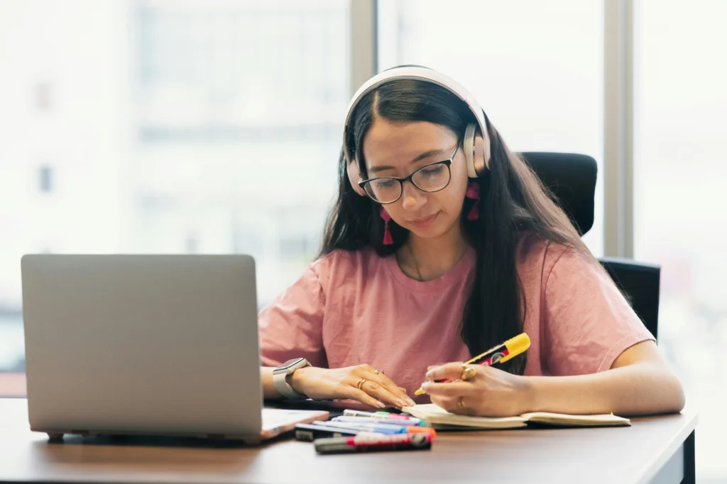 Indian Girl Learning Social Media Marketing Course Online with Laptop